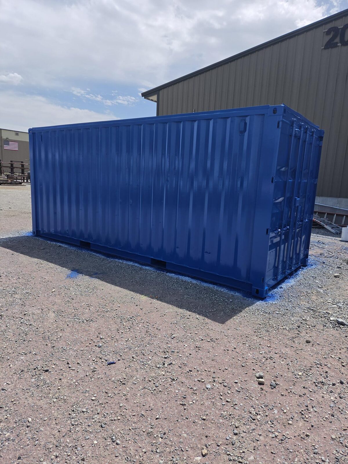 The finished shipping container repainted in blue high-solids polyurethane over epoxy primer